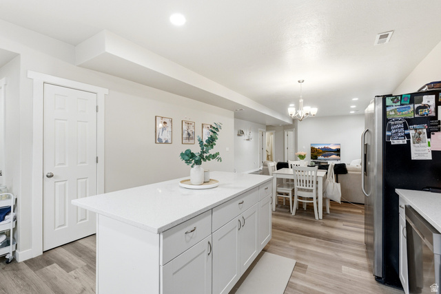 1434 West Stable Street Lindon, UT 84042 - Photo 76 of 76 Kitchen with stainless steel fridge, a center island, open floor plan, and light wood-type flooring