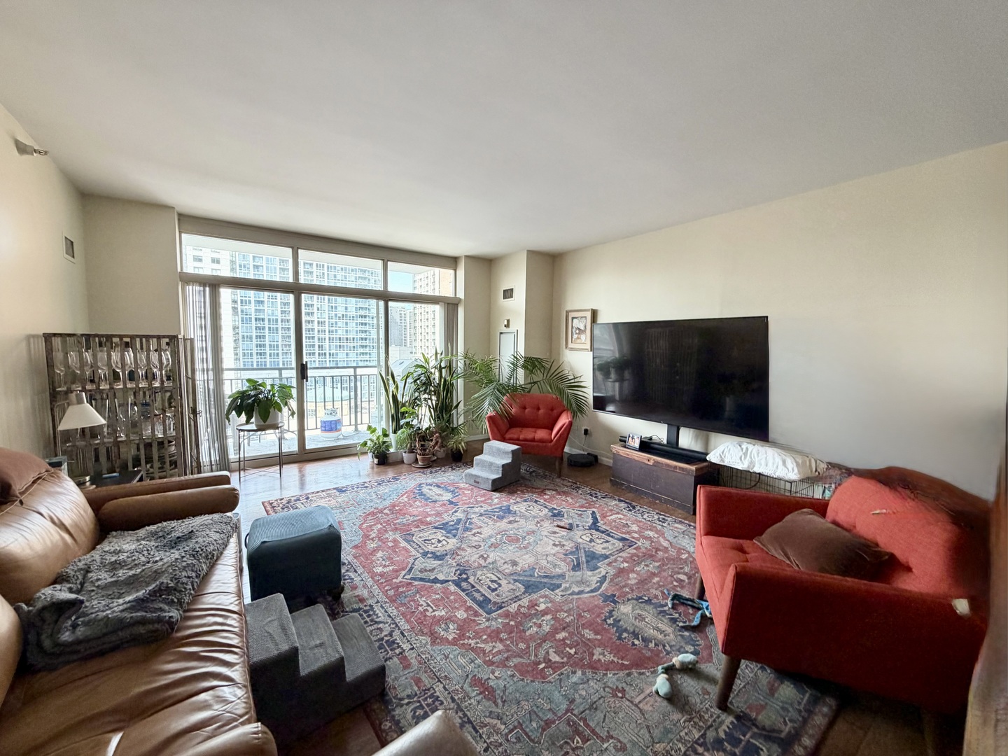 21 West Chestnut Street, Unit 1101 Chicago, IL 60610 - Photo 2 of 16 a living room with furniture and a flat screen tv
