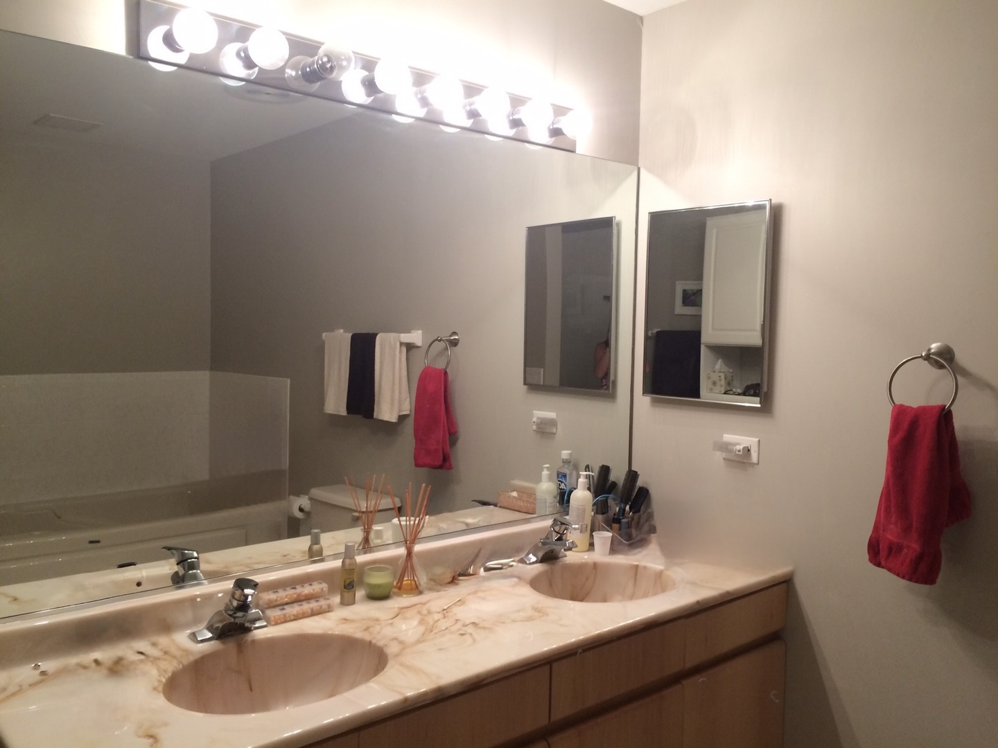 21 West Chestnut Street, Unit 1101 Chicago, IL 60610 - Photo 9 of 16 a bathroom with a sink and a mirror