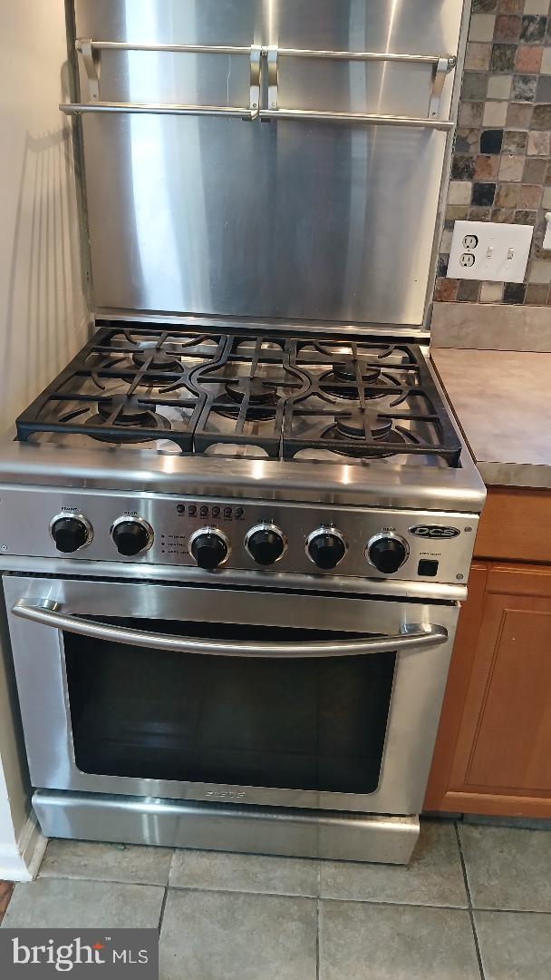 960 Dale Road Secane, PA 19018 - Photo 11 of 23 a stove top oven sitting inside of a kitchen