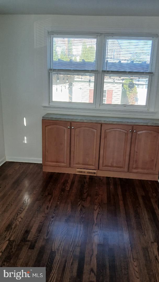 960 Dale Road Secane, PA 19018 - Photo 12 of 23 a view of an empty room with wooden floor and a window