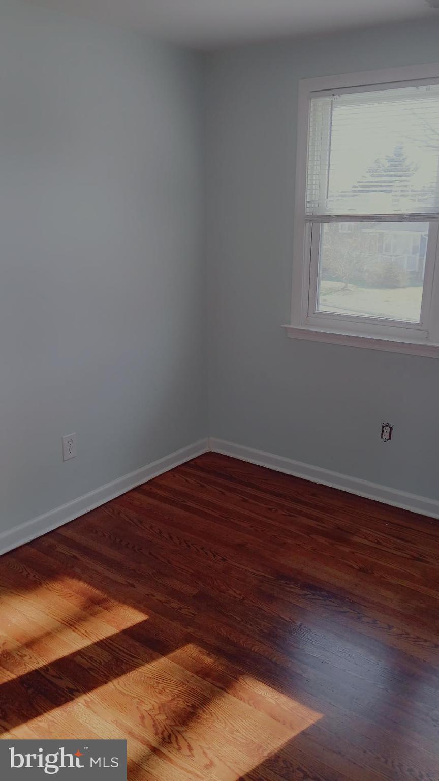 960 Dale Road Secane, PA 19018 - Photo 6 of 23 a view of a small space with wooden floor and a window