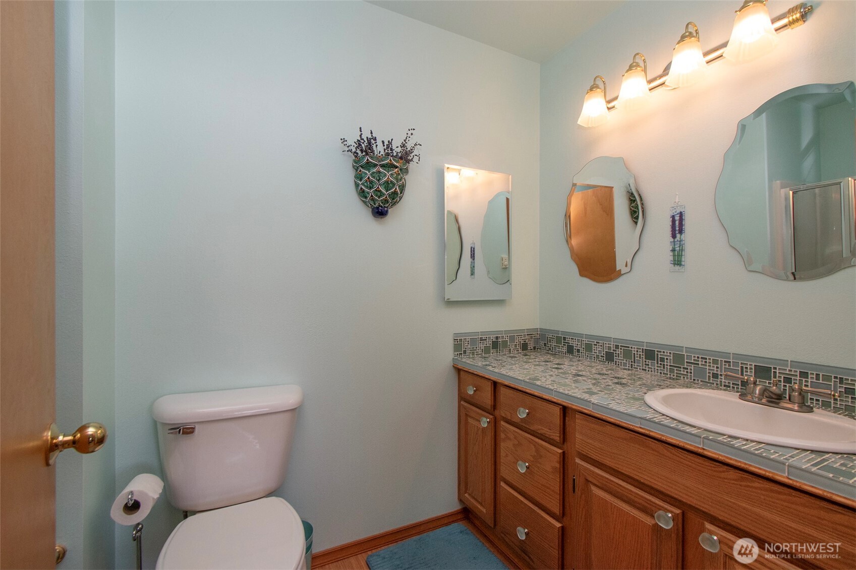 101 Timothy Lane Sequim, WA 98382 - Photo 25 of 39 a bathroom with a granite countertop toilet sink and mirror