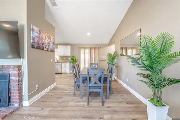 a kitchen with granite countertop white cabinets and appliances