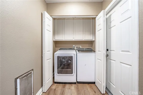 a bathroom with a granite countertop toilet sink and mirror