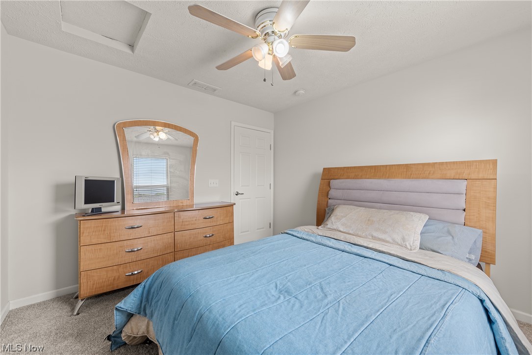 3967 Gardiner Run Akron, OH 44321 - Photo 27 of 35 Carpeted bedroom with ceiling fan