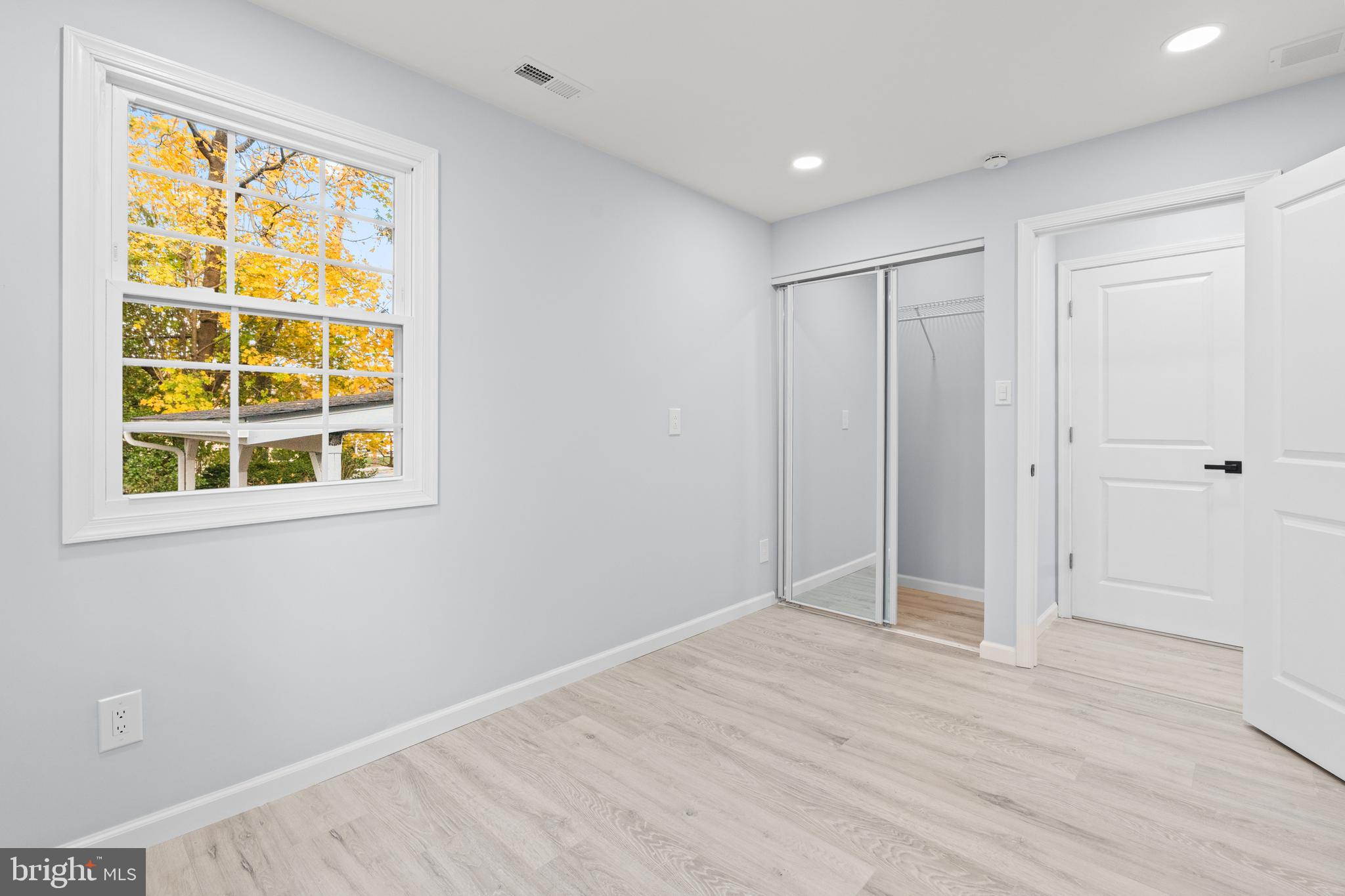 11046 Ferndale Street Philadelphia, PA 19116 - Photo 12 of 37 a view of an empty room with wooden floor and windows