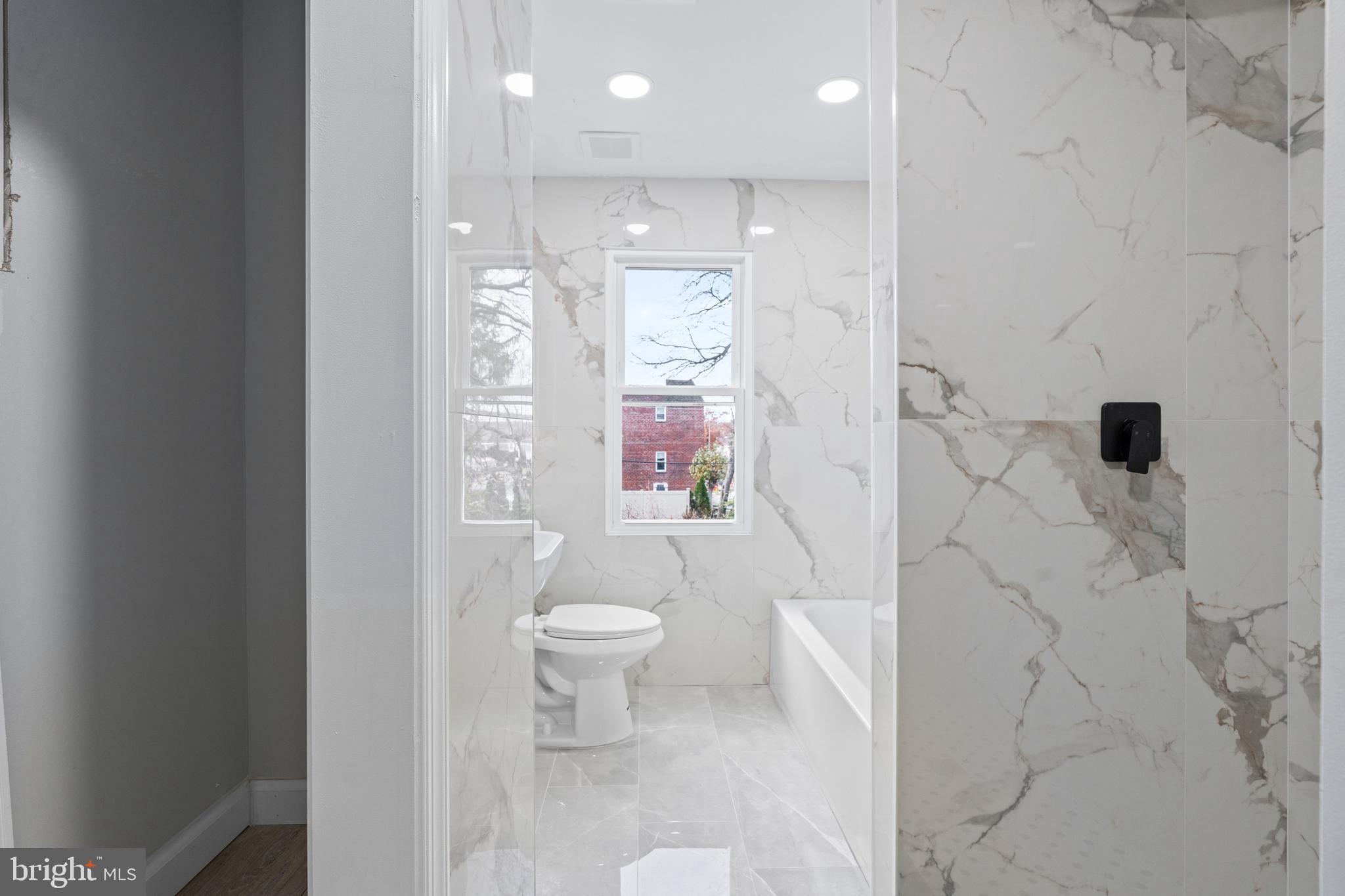 11046 Ferndale Street Philadelphia, PA 19116 - Photo 23 of 37 a bathroom with a toilet sink and shower