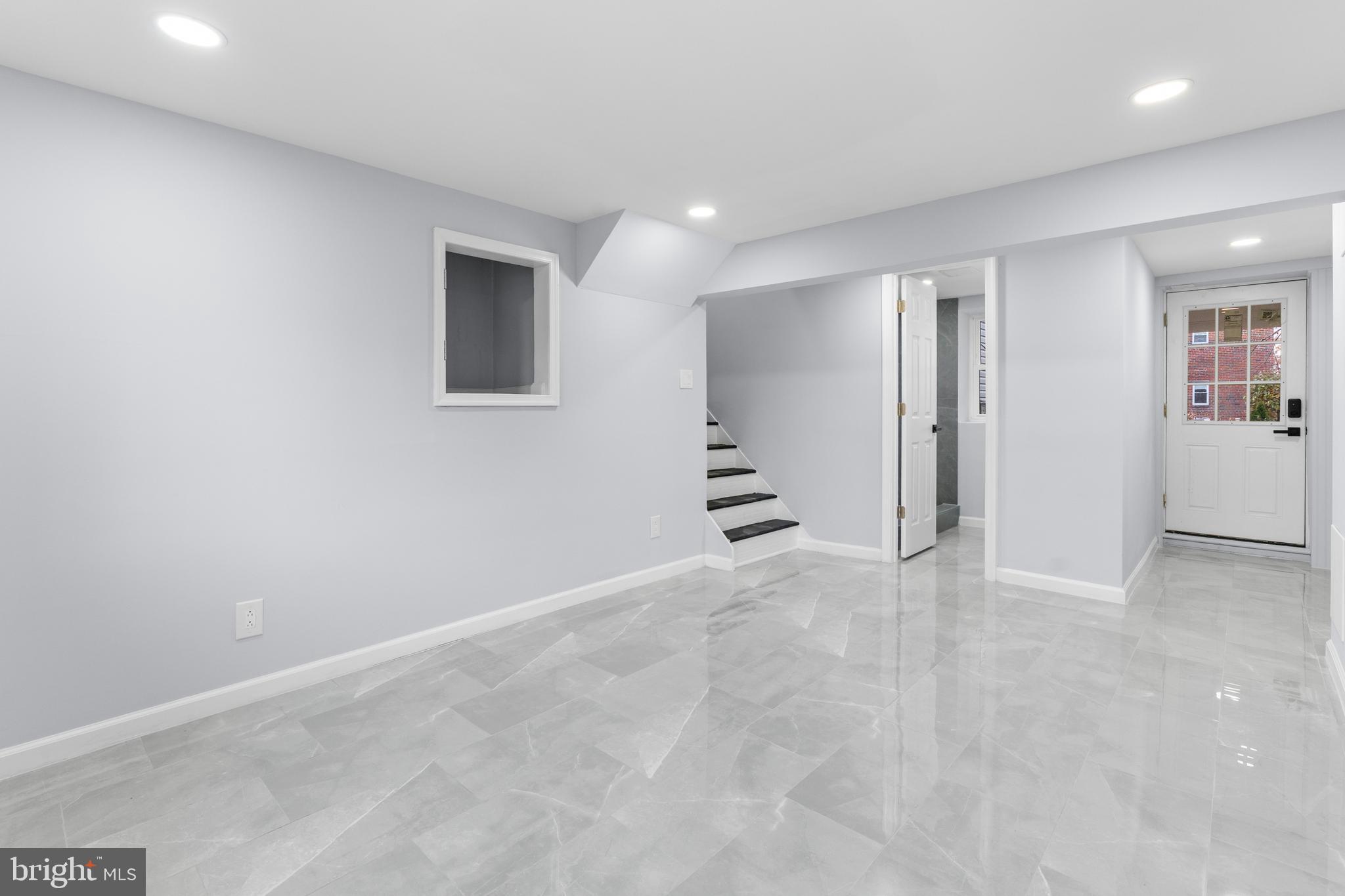 11046 Ferndale Street Philadelphia, PA 19116 - Photo 28 of 37 an empty room with wooden floor and windows