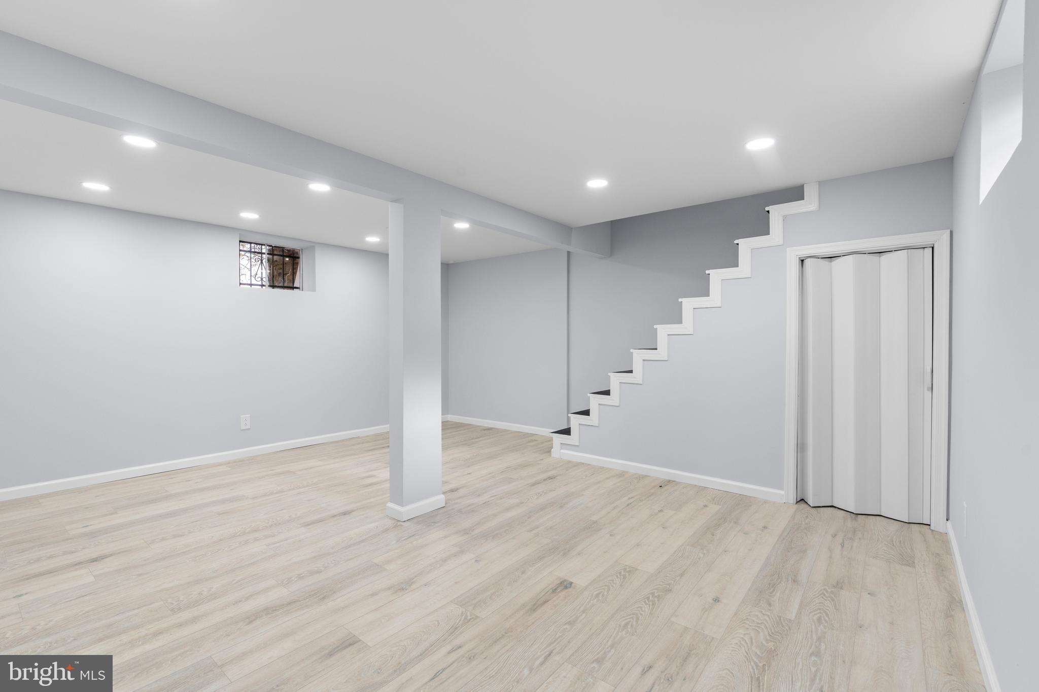 11046 Ferndale Street Philadelphia, PA 19116 - Photo 34 of 37 an empty room with wooden floor and windows