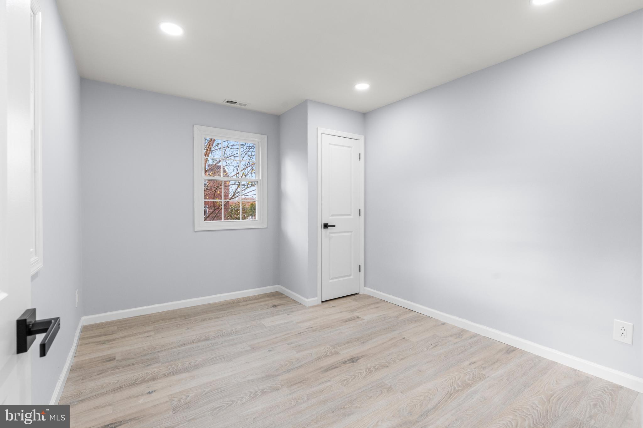 11046 Ferndale Street Philadelphia, PA 19116 - Photo 9 of 37 an empty room with wooden floor and windows