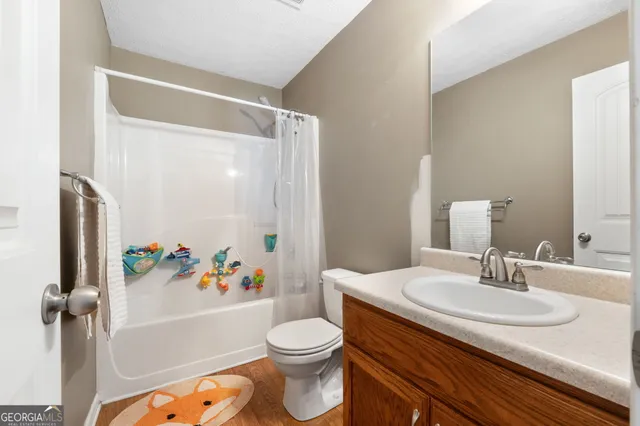 a bathroom with a sink toilet and bathtub