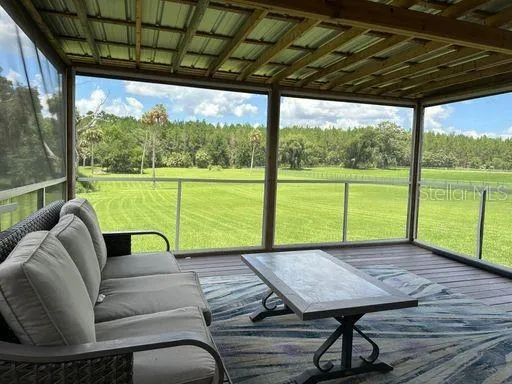 a view of a living room with furniture and a yard
