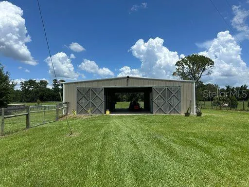 a view of a house with a backyard and a garden