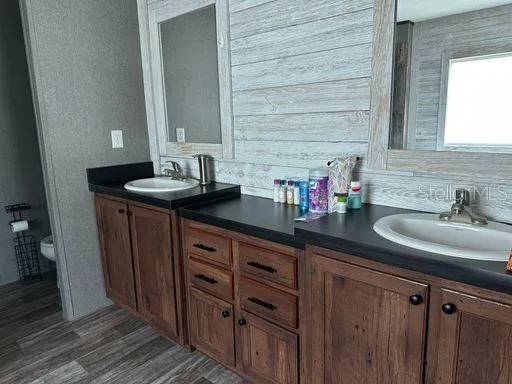 a bathroom with a sink and a mirror