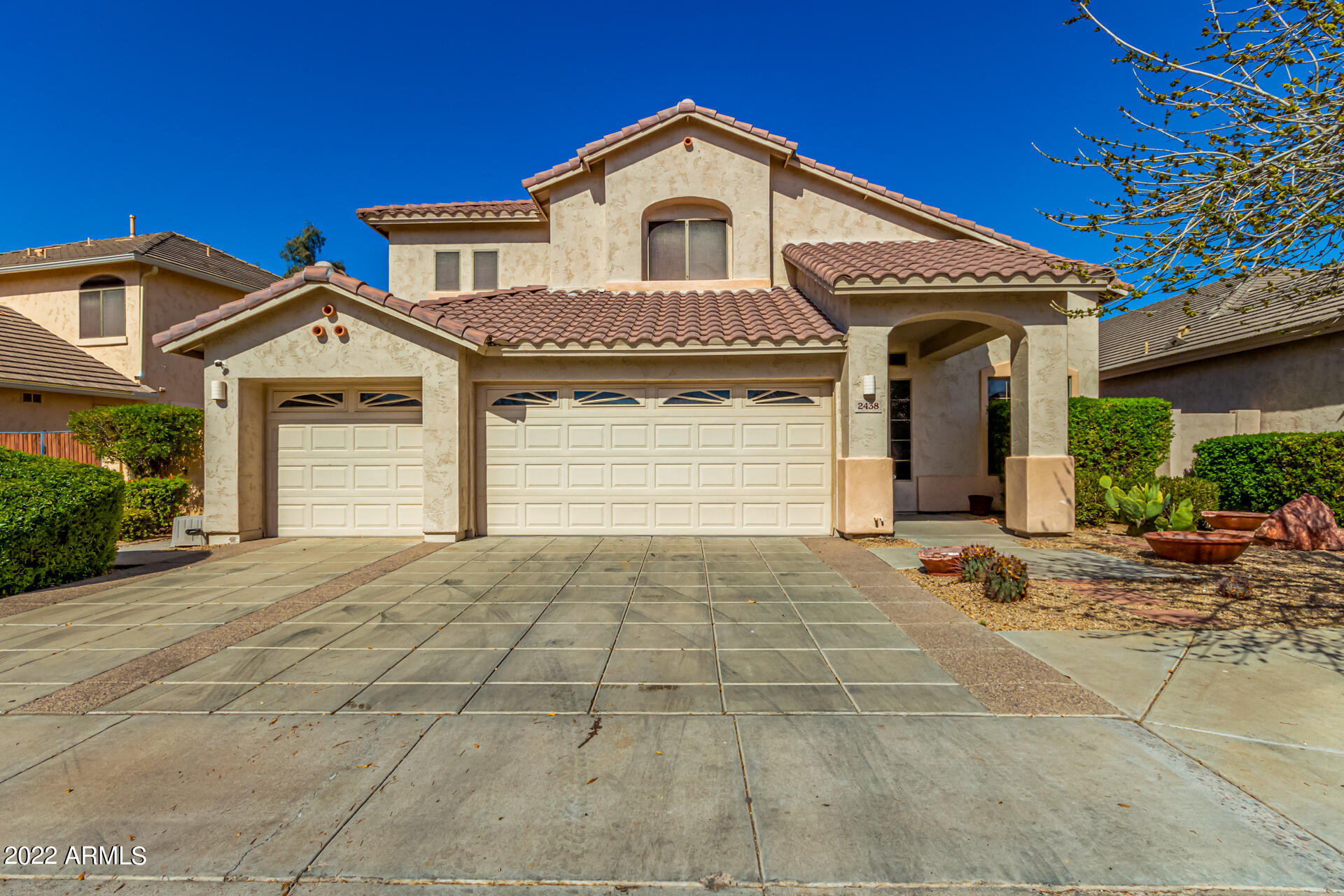 2438 East Fremont Road Phoenix, AZ 85042 - Photo 1 of 45 a front view of a house with a yard and garage