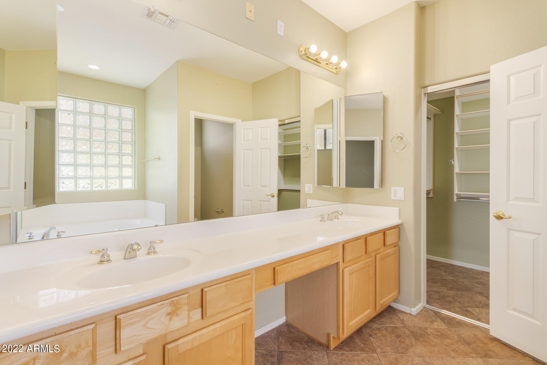 2438 East Fremont Road Phoenix, AZ 85042 - Photo 20 of 45 a bathroom with a sink double vanity and a mirror