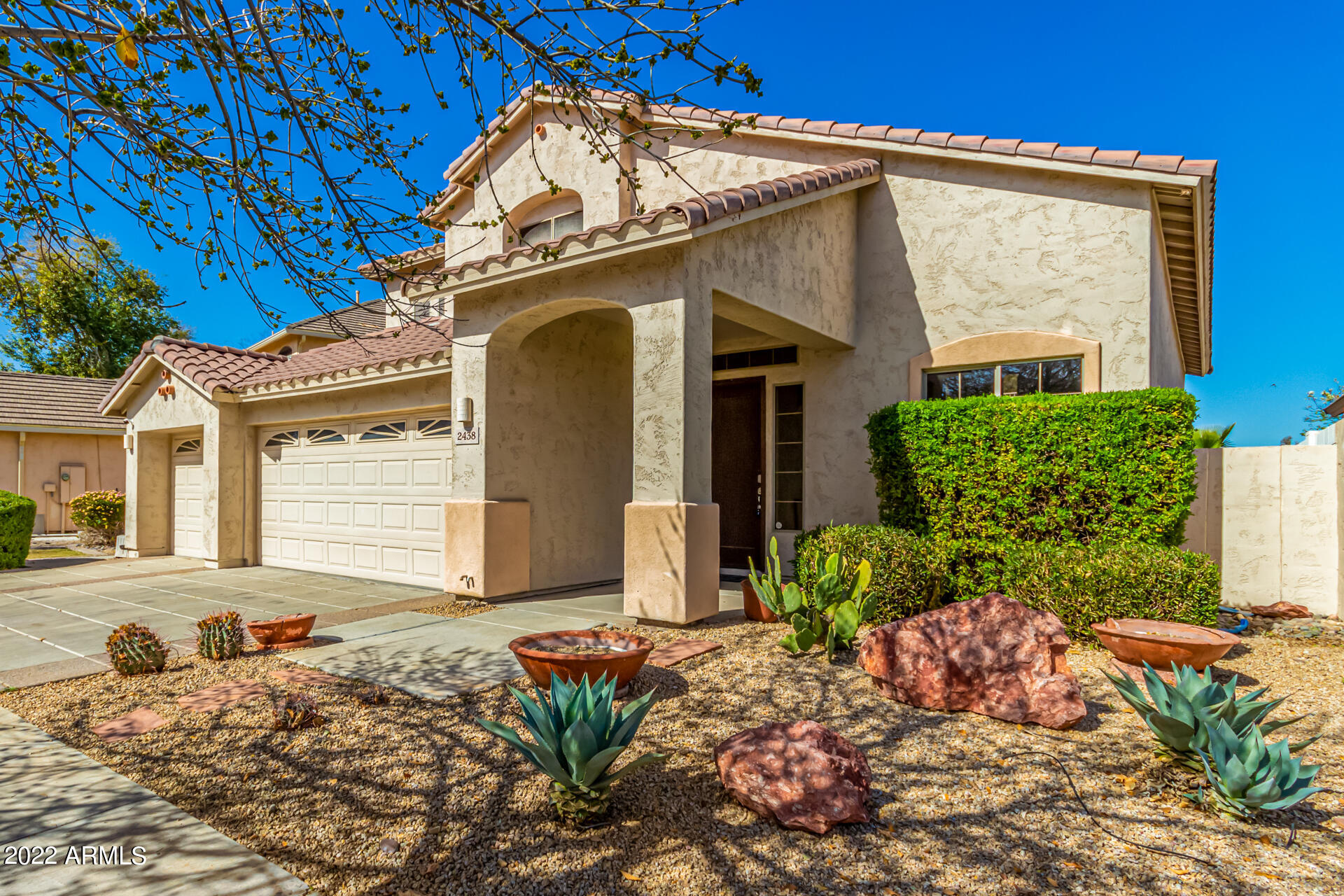 2438 East Fremont Road Phoenix, AZ 85042 - Photo 2 of 45 a front view of a house with a yard