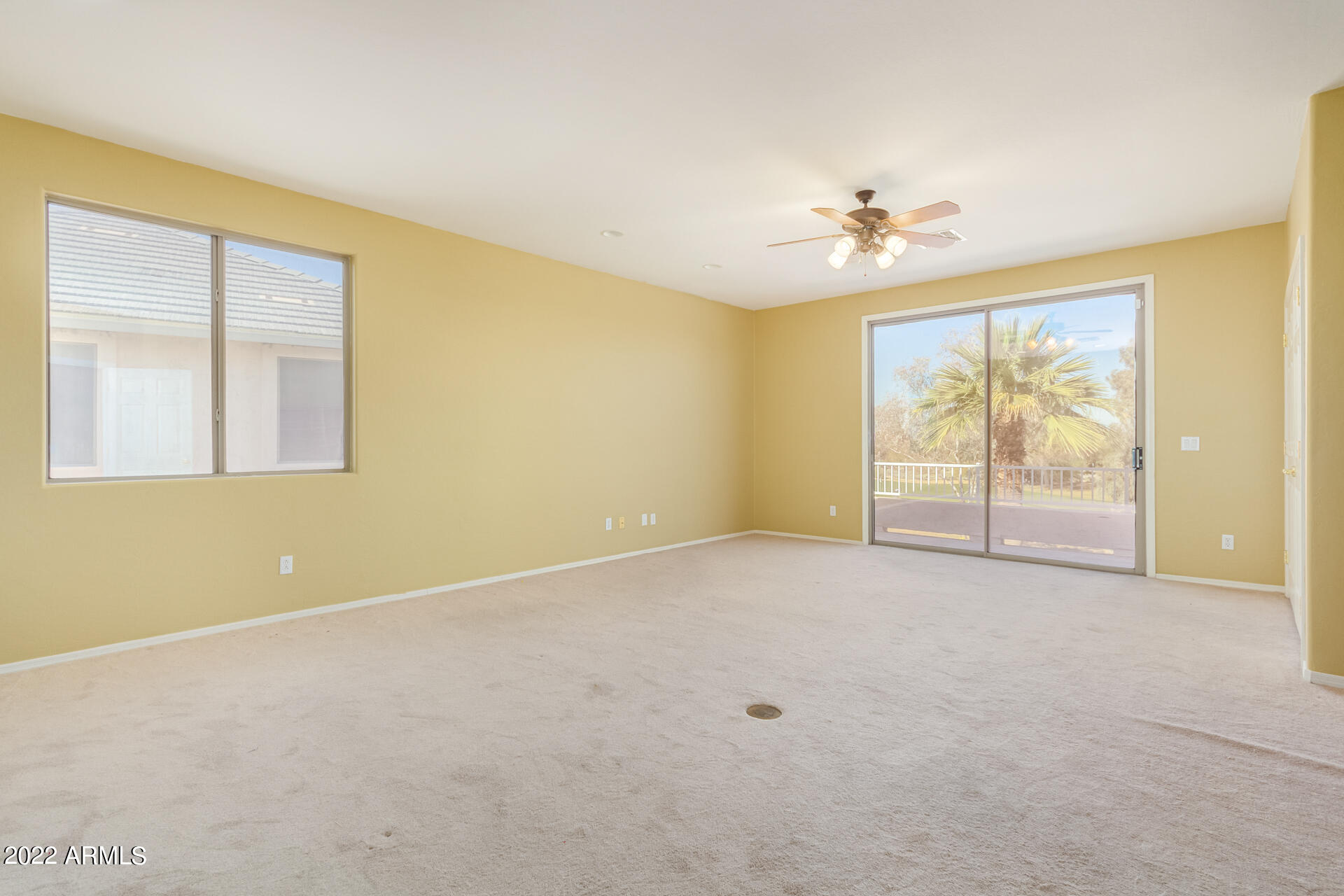2438 East Fremont Road Phoenix, AZ 85042 - Photo 23 of 45 an empty room with windows and ceiling fan