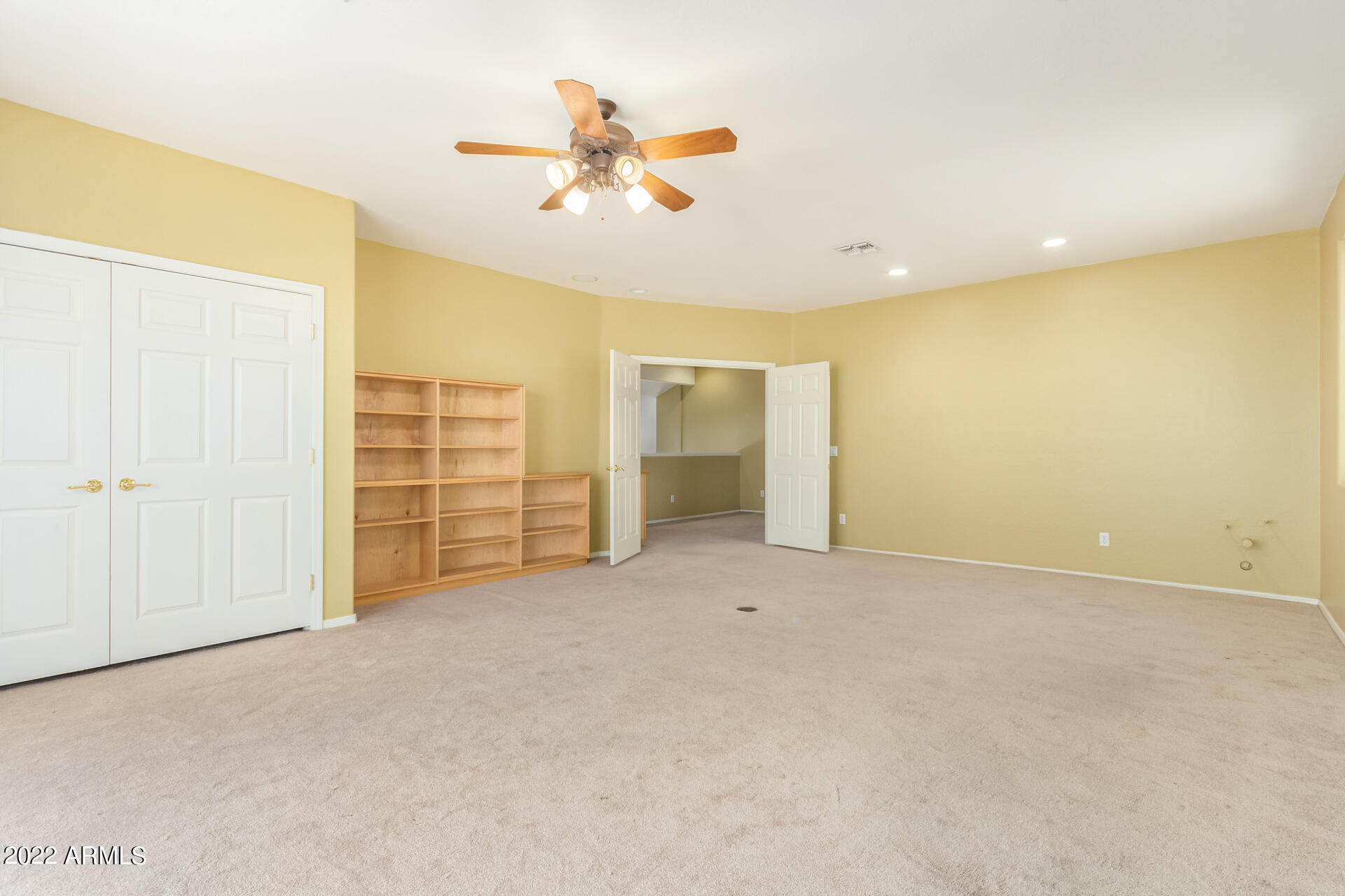 2438 East Fremont Road Phoenix, AZ 85042 - Photo 24 of 45 an empty room with closet and windows