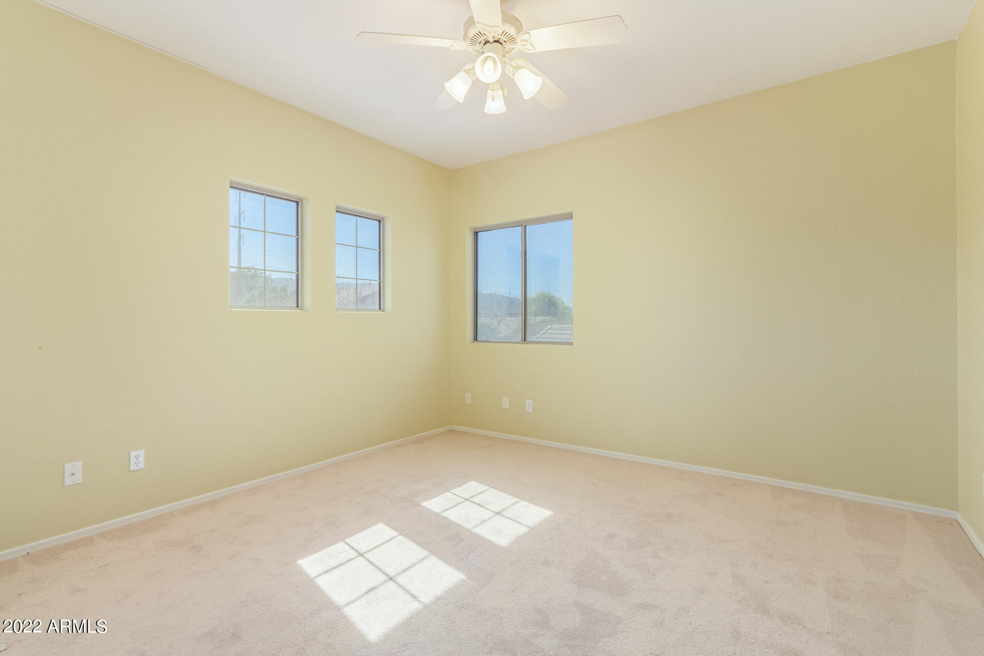 2438 East Fremont Road Phoenix, AZ 85042 - Photo 27 of 45 a view of an empty room and chandelier fan