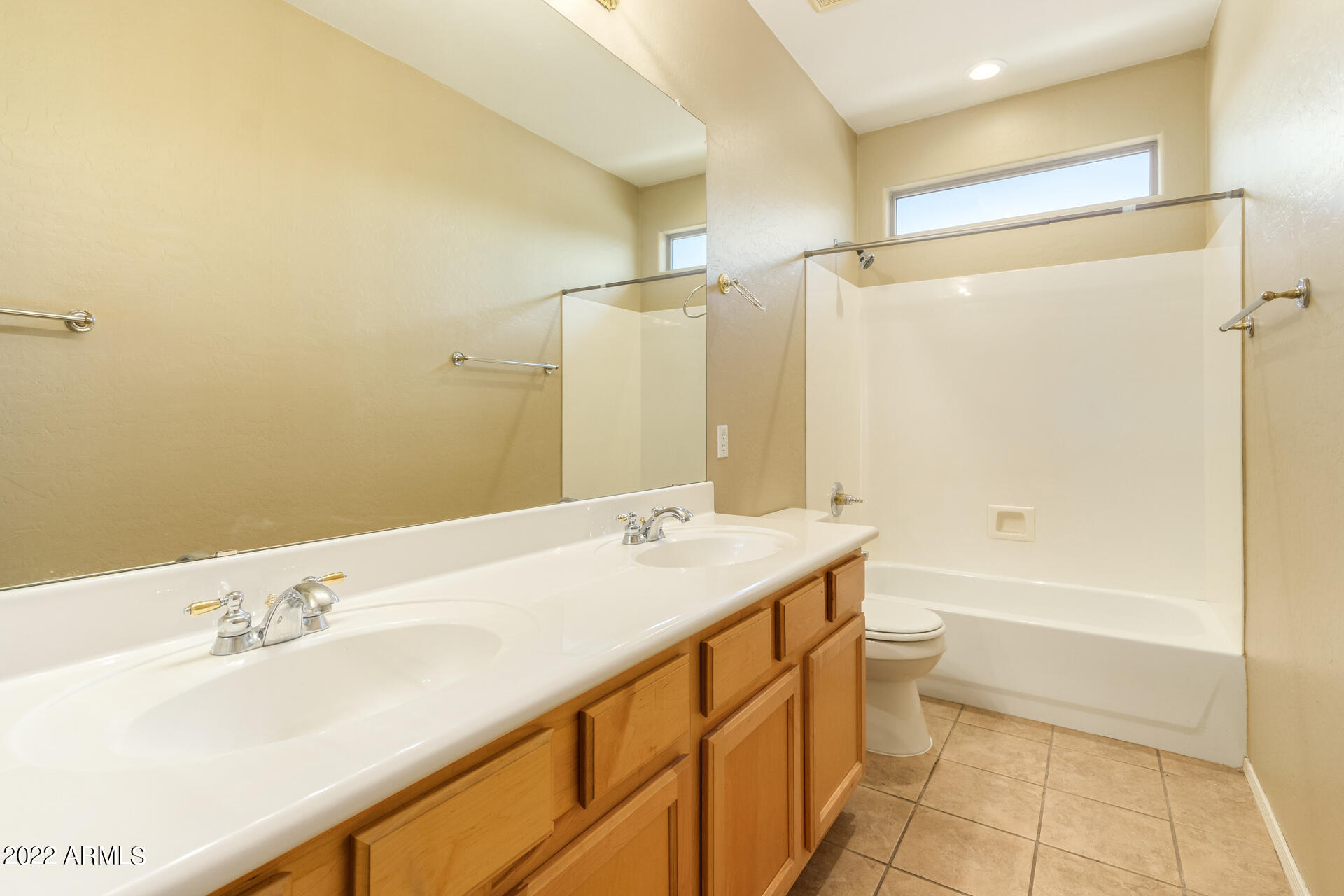 2438 East Fremont Road Phoenix, AZ 85042 - Photo 28 of 45 a bathroom with a sink and a mirror
