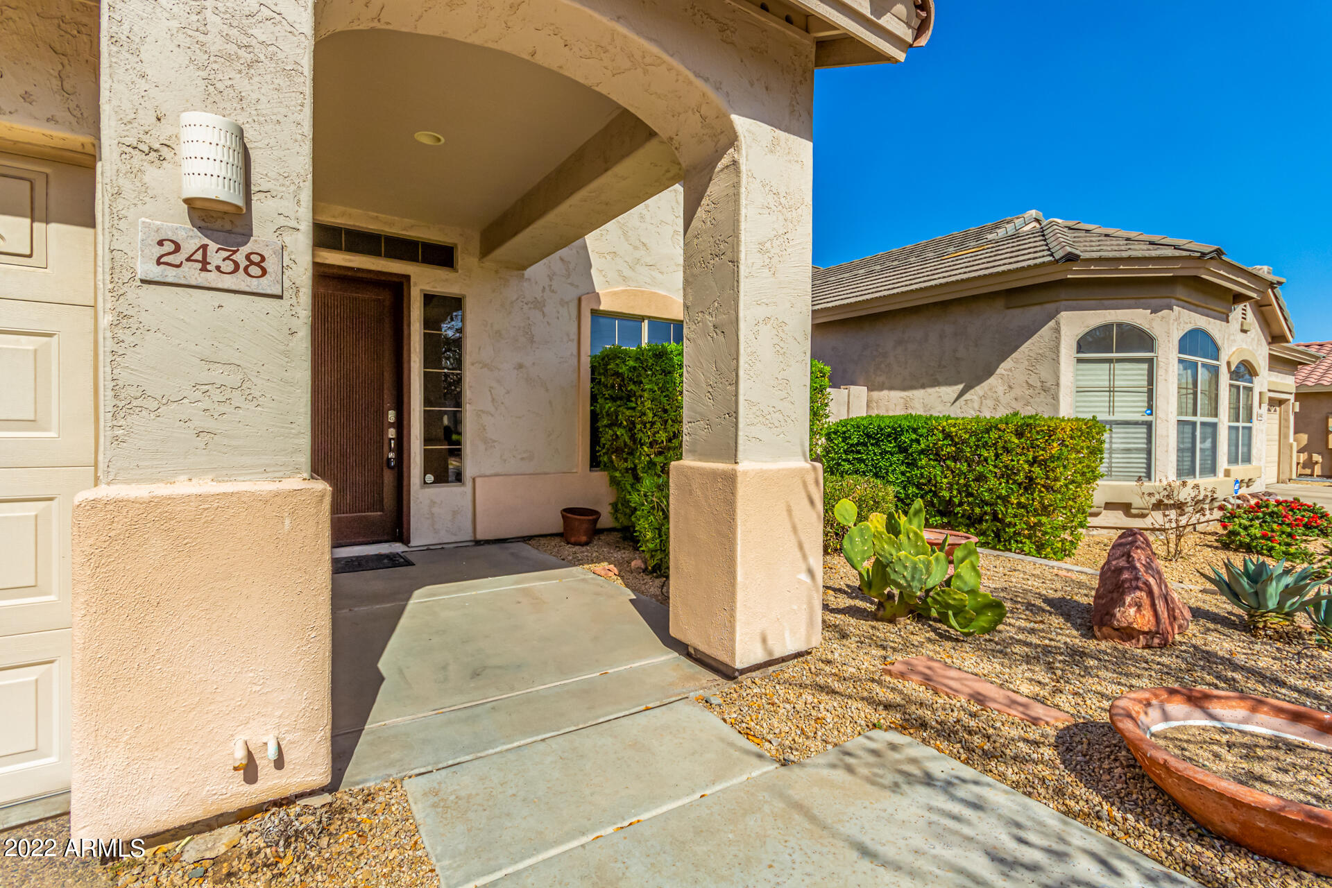 2438 East Fremont Road Phoenix, AZ 85042 - Photo 3 of 45 a front view of a house with a yard