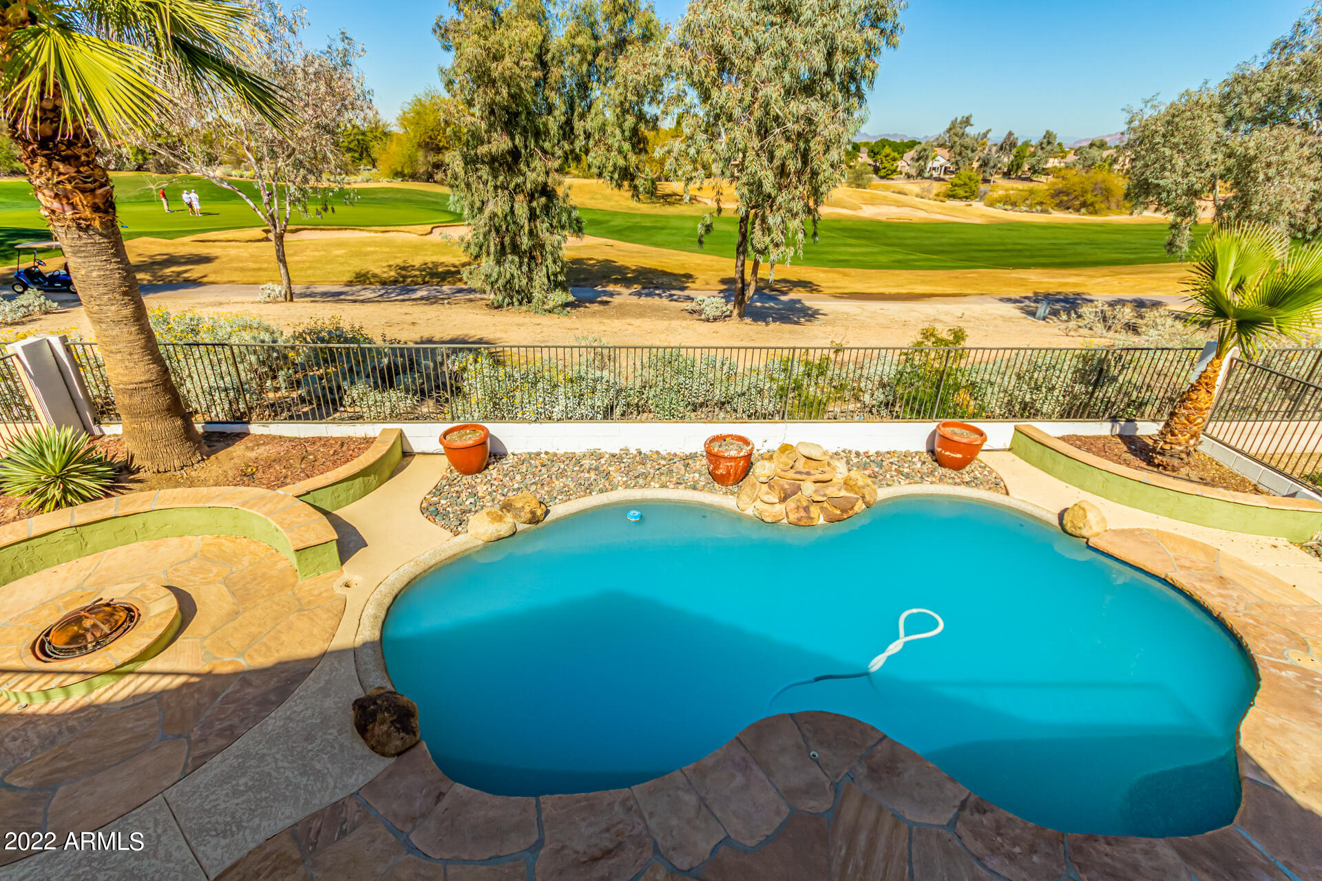 2438 East Fremont Road Phoenix, AZ 85042 - Photo 33 of 45 a view of a swimming pool with an outdoor seating