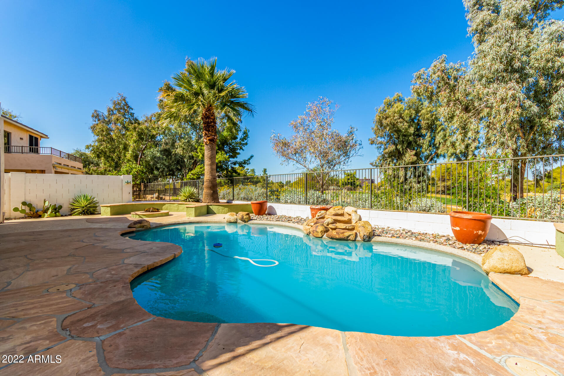 2438 East Fremont Road Phoenix, AZ 85042 - Photo 41 of 45 a view of a swimming pool with an outdoor space and seating area