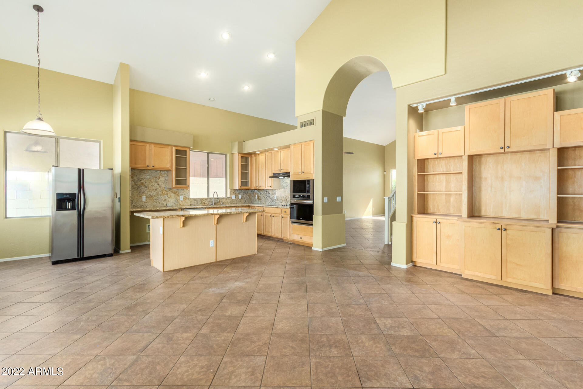 2438 East Fremont Road Phoenix, AZ 85042 - Photo 9 of 45 a large white kitchen with a large window cabinets and stainless steel appliances