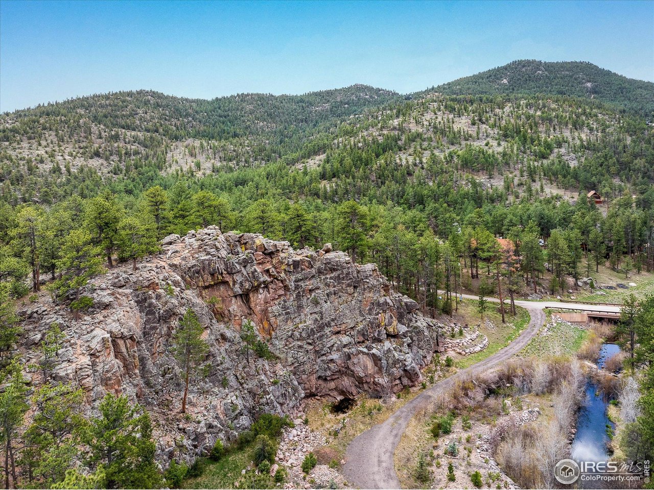 1289 Kiowa Road Lyons, CO 80540 - Photo 24 of 37 a view of a mountain with a mountain in the background