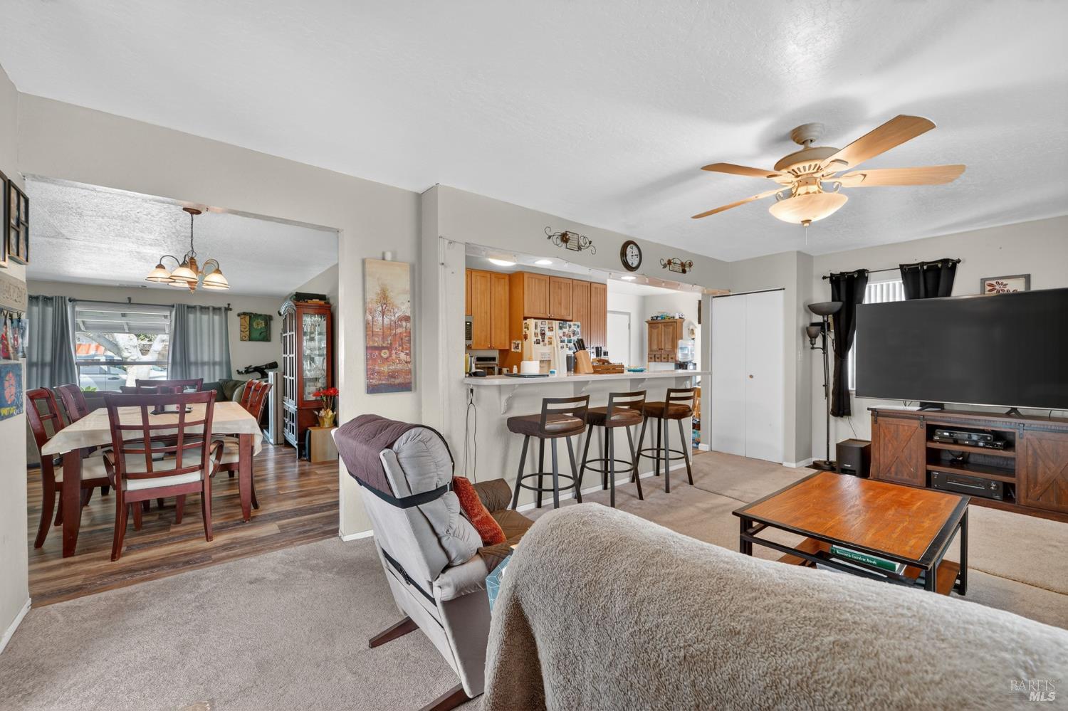 127 Jackson Way Vallejo, CA 94591 - Photo 13 of 35 a living room with furniture a flat screen tv and kitchen view