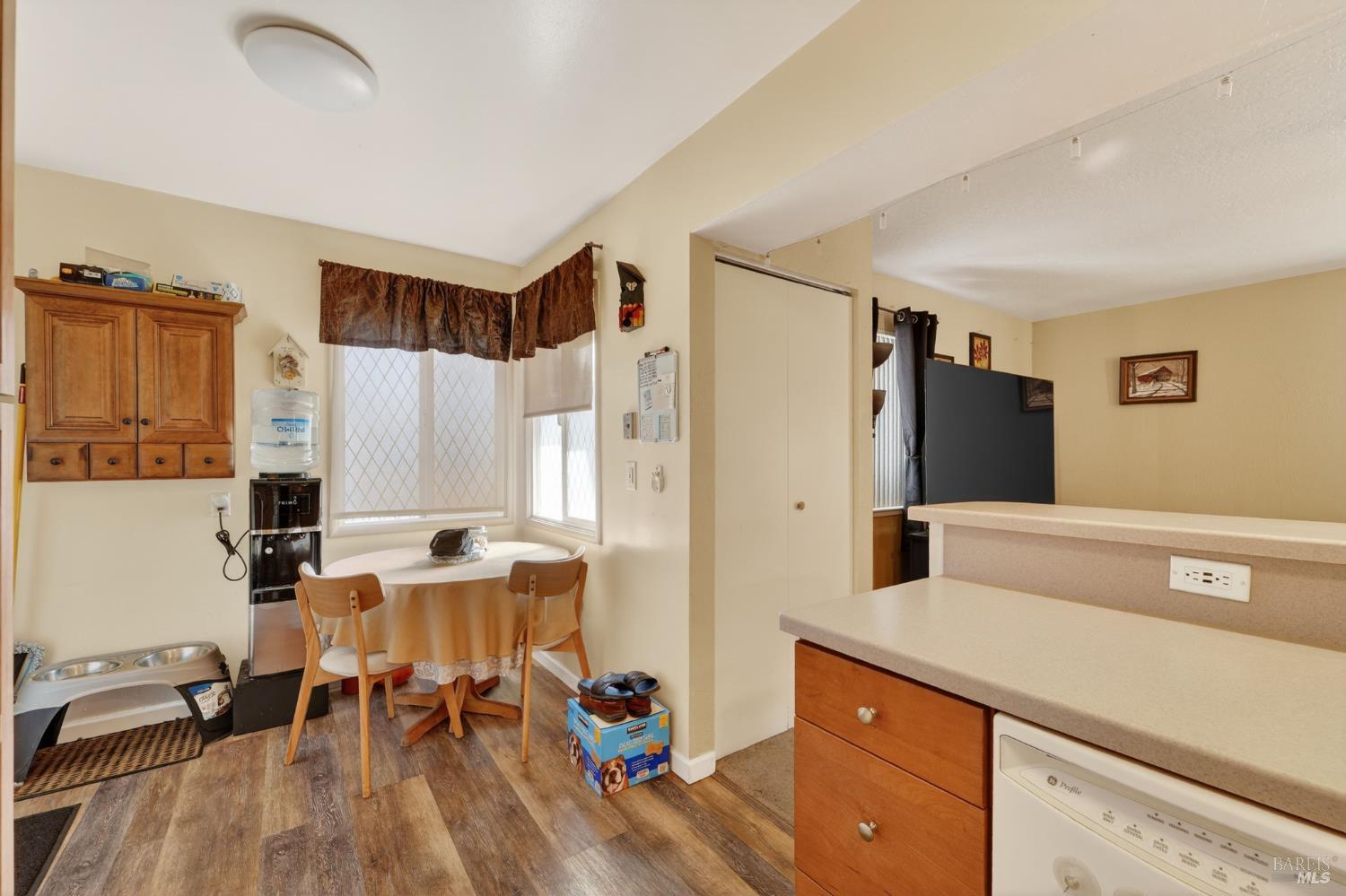 127 Jackson Way Vallejo, CA 94591 - Photo 18 of 35 a room with stainless steel appliances a refrigerator and wooden floor