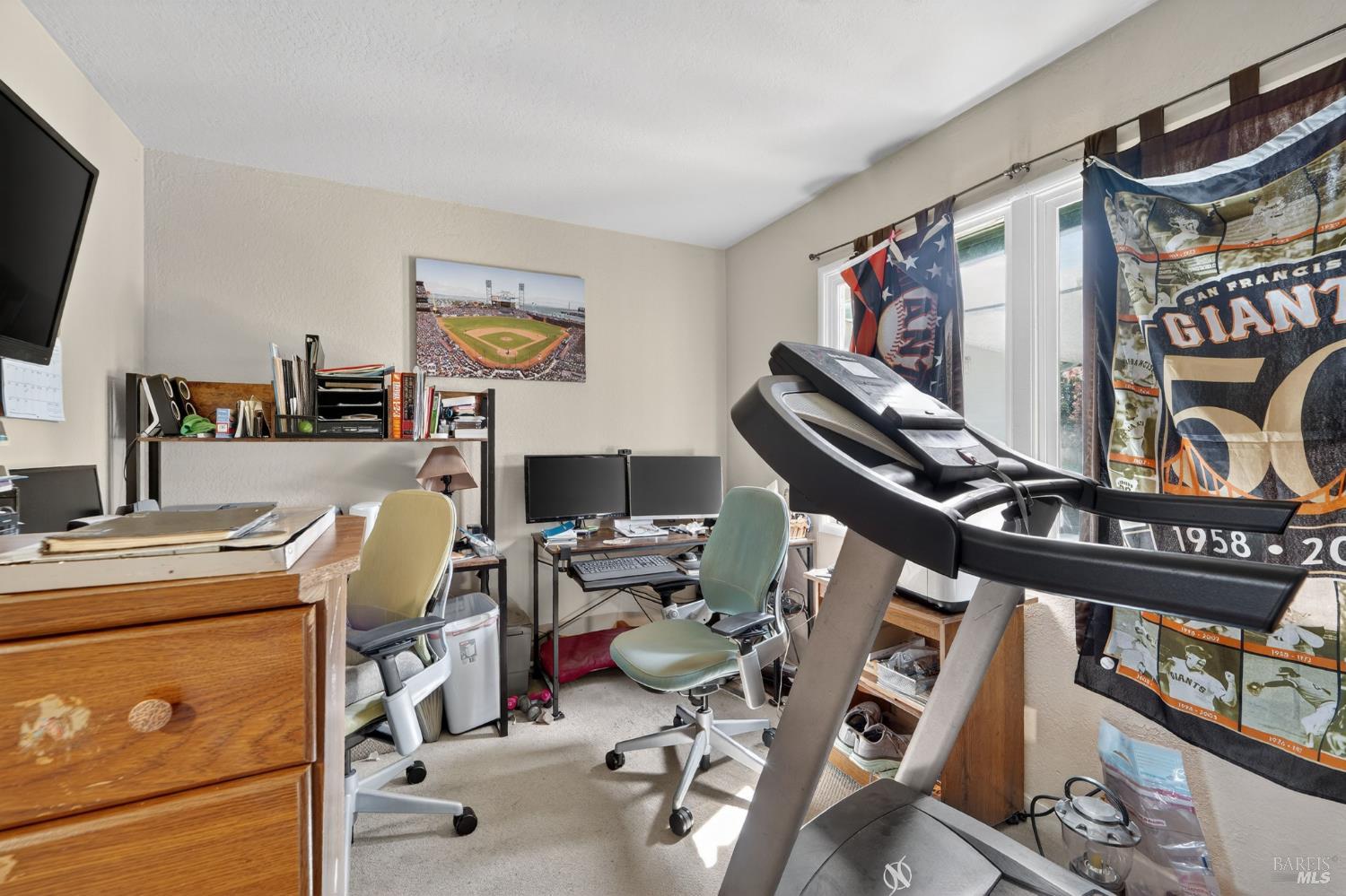 127 Jackson Way Vallejo, CA 94591 - Photo 19 of 35 a view of a workspace with furniture and a flat screen tv