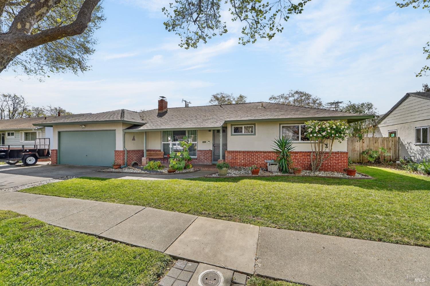 127 Jackson Way Vallejo, CA 94591 - Photo 2 of 35 a front view of a house with a yard and potted plants
