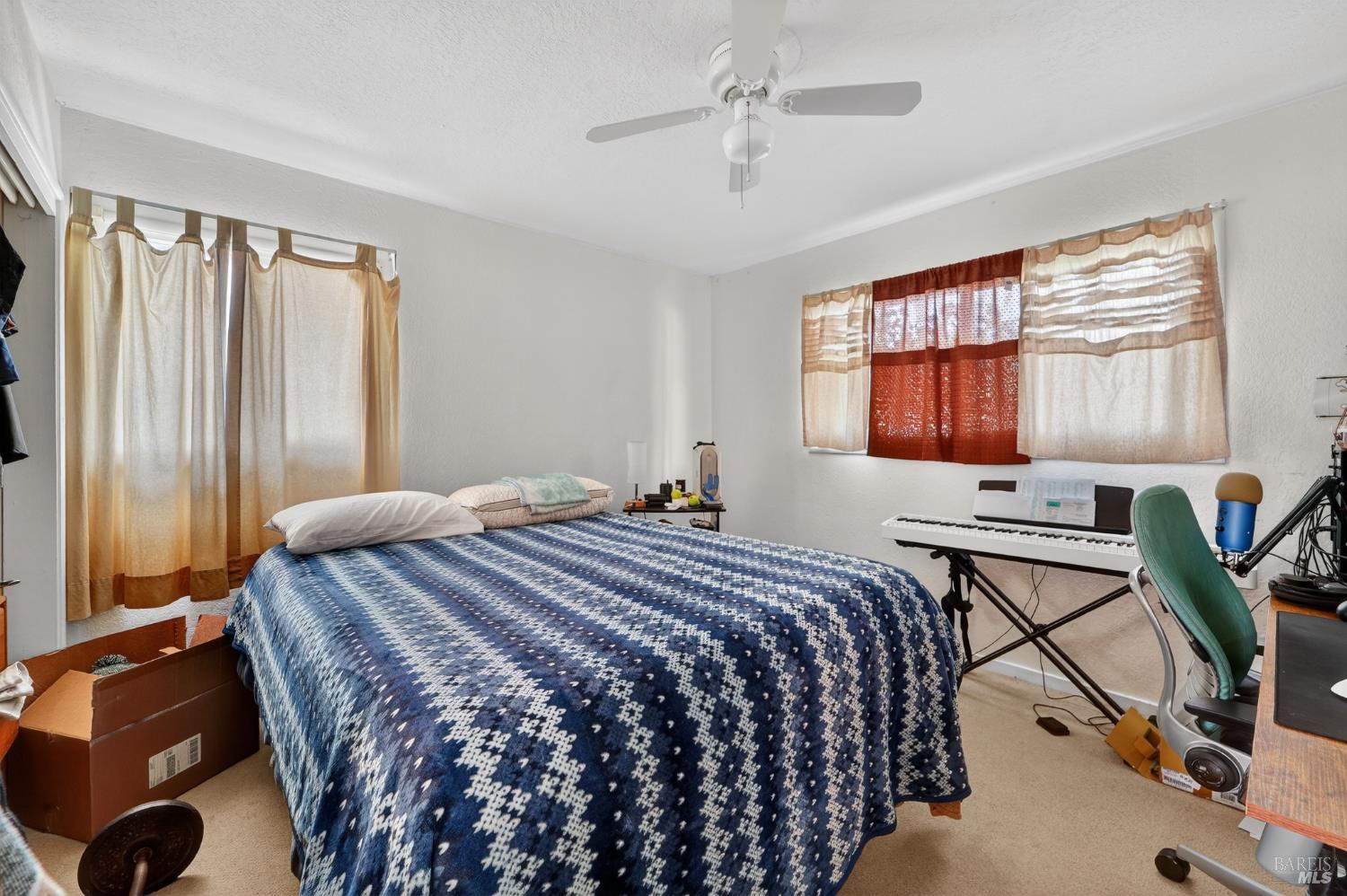 127 Jackson Way Vallejo, CA 94591 - Photo 21 of 35 a bedroom with a bed and a chandelier