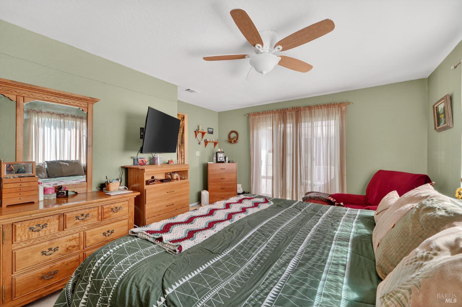 127 Jackson Way Vallejo, CA 94591 - Photo 26 of 35 a bedroom with a bed and a flat screen tv