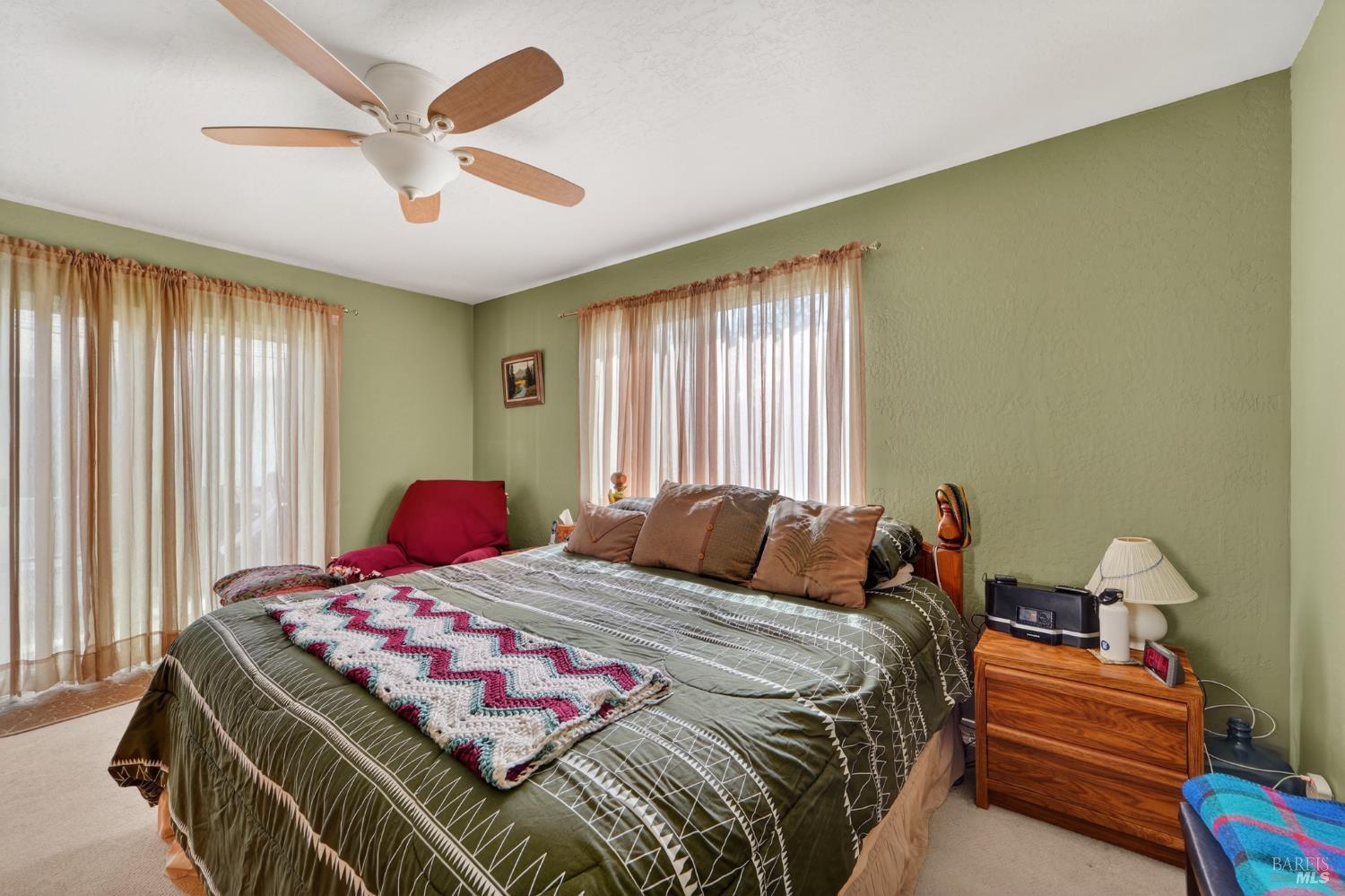 127 Jackson Way Vallejo, CA 94591 - Photo 27 of 35 a bedroom with a bed and a chandelier