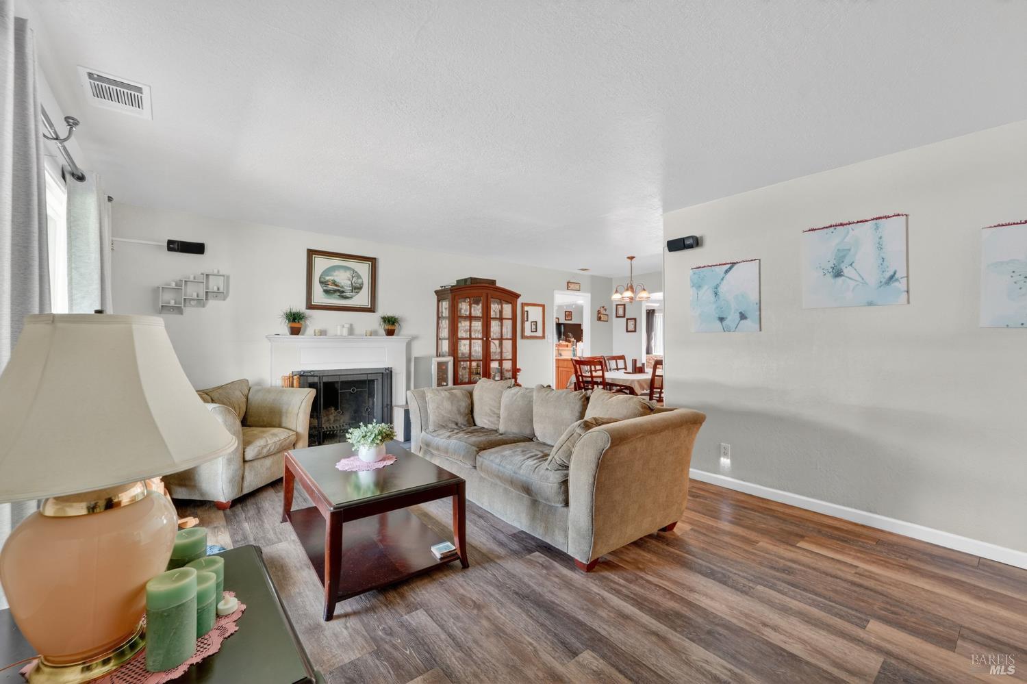 127 Jackson Way Vallejo, CA 94591 - Photo 4 of 35 a living room with furniture and a wooden floor