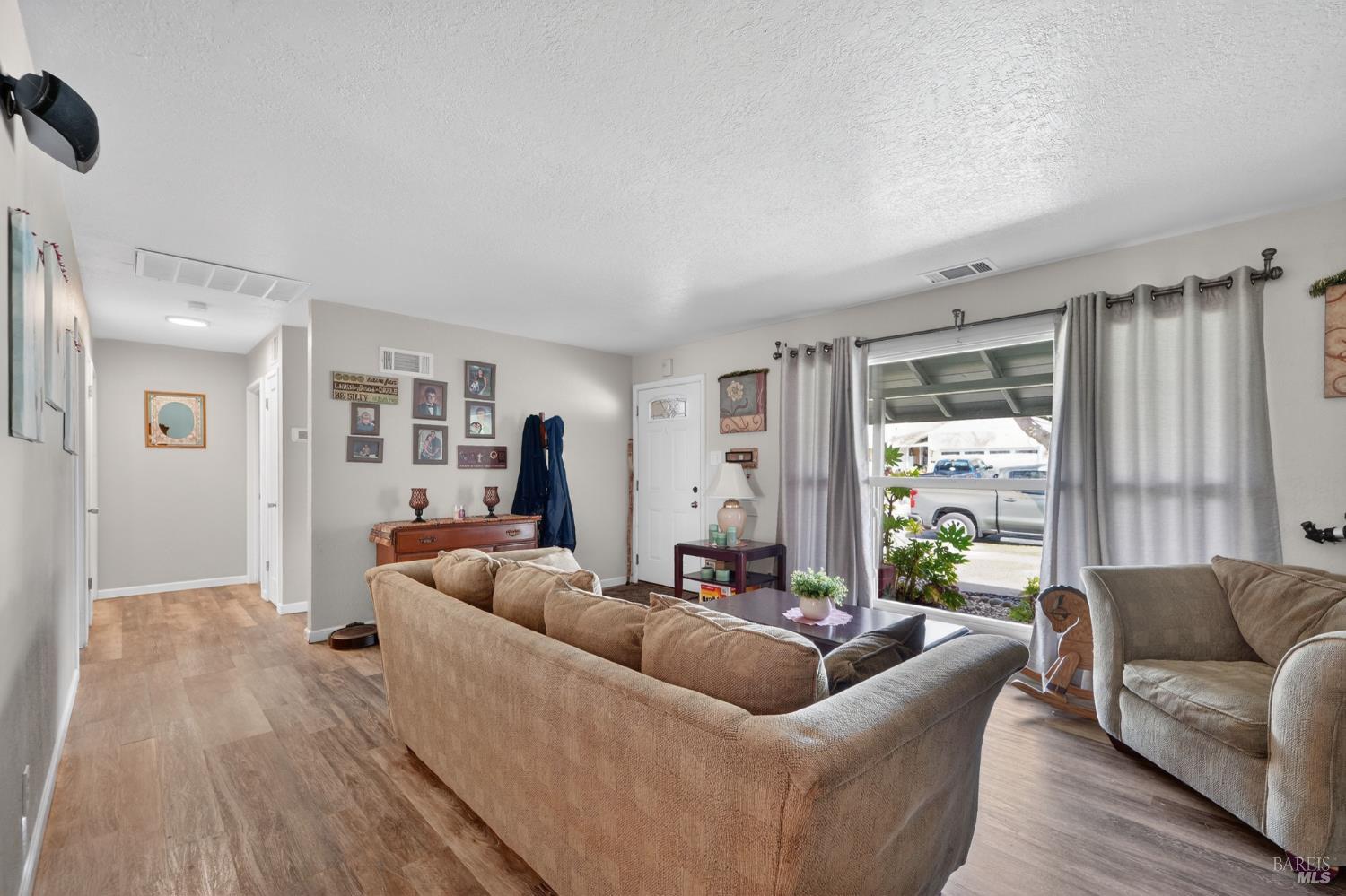 127 Jackson Way Vallejo, CA 94591 - Photo 6 of 35 a living room with furniture and a large window