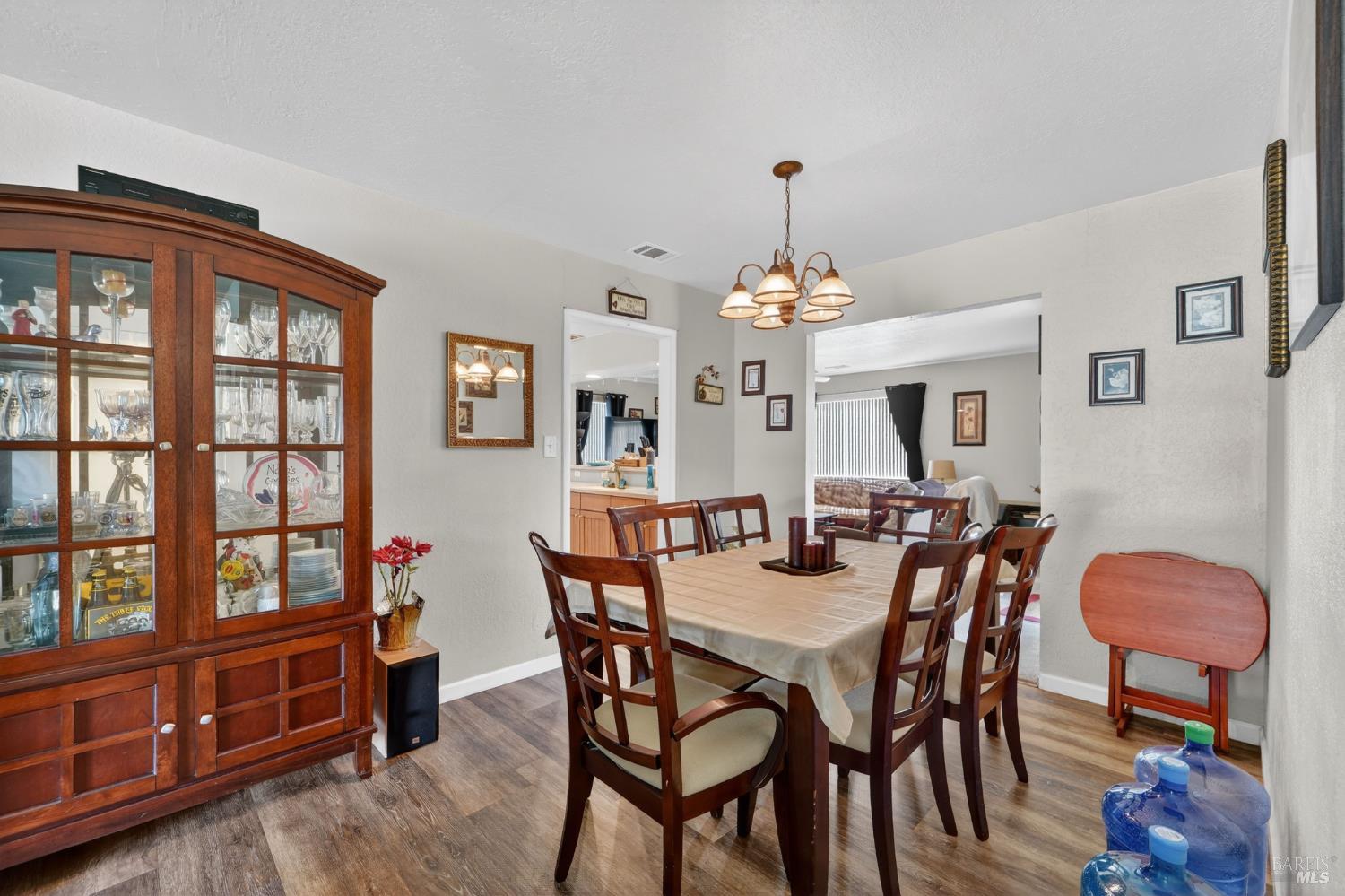 127 Jackson Way Vallejo, CA 94591 - Photo 8 of 35 a view of a dining room with furniture and chandelier