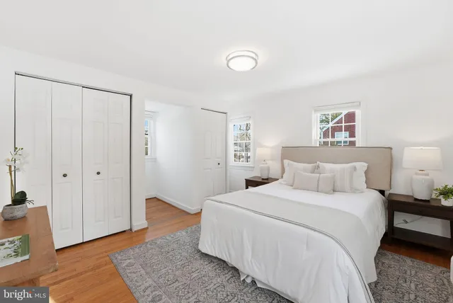 a bedroom with a large bed and a couch