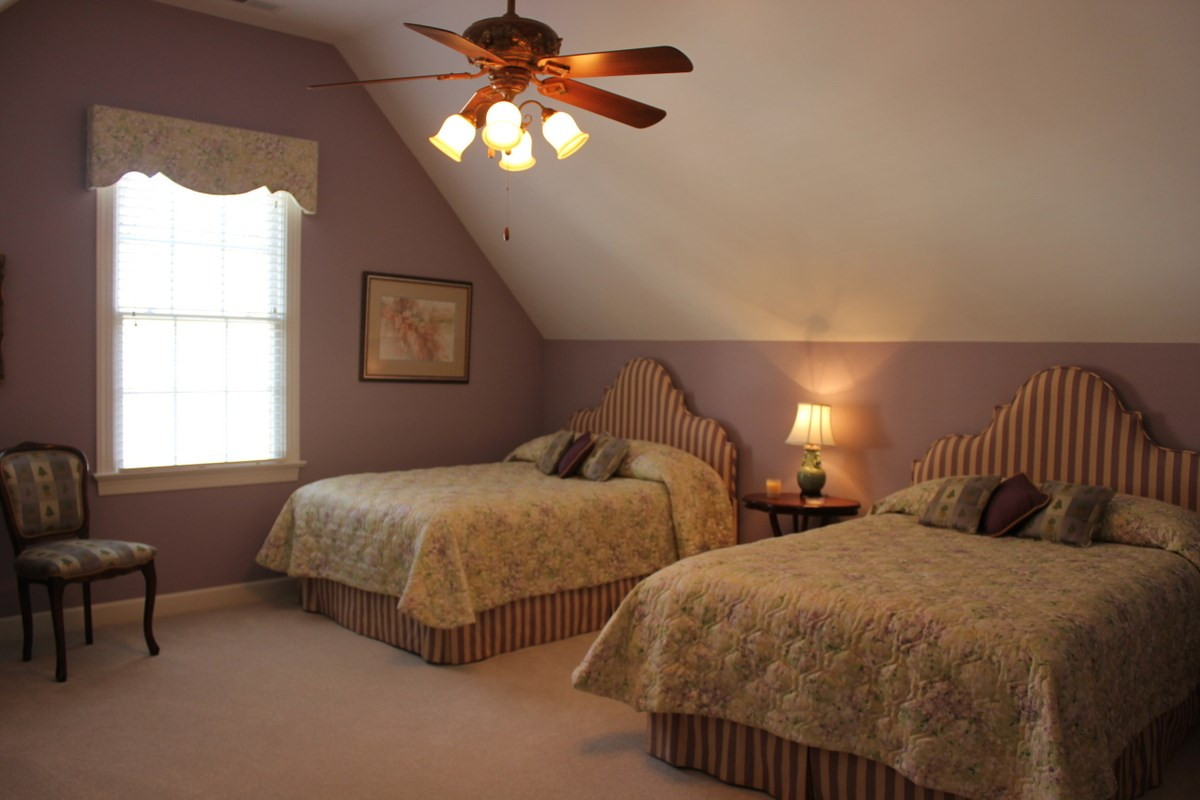 7405 Fontana Ridge Lane Raleigh, NC 27613 - Photo 12 of 25 Double closets in third bedroom is great for seasonal storage. Overhead lighting.Huge bedroom with cathedral ceiling - Designer ceiling fan Two large closets Bedroom