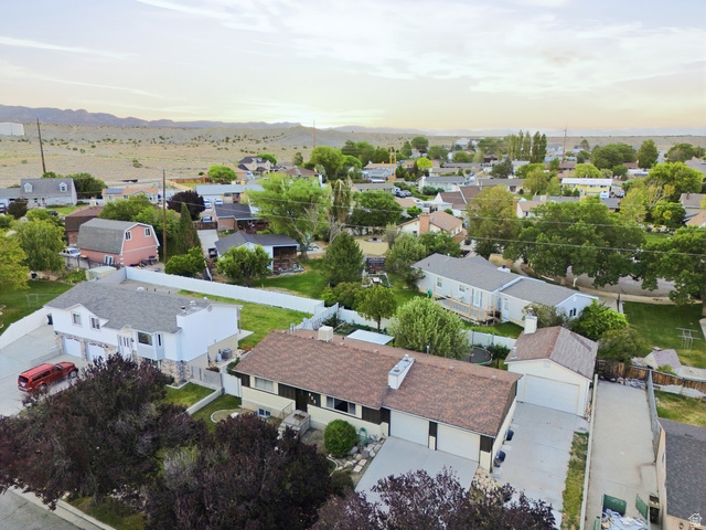 822 Pinewood Circle Price, UT 84501 - Photo 2 of 49 Aerial perspective showcasing a residential area with mature trees and suburban homes