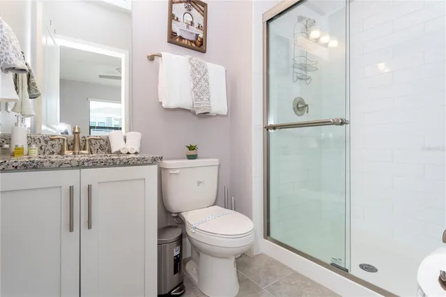 a spacious bedroom with a bed and a large window