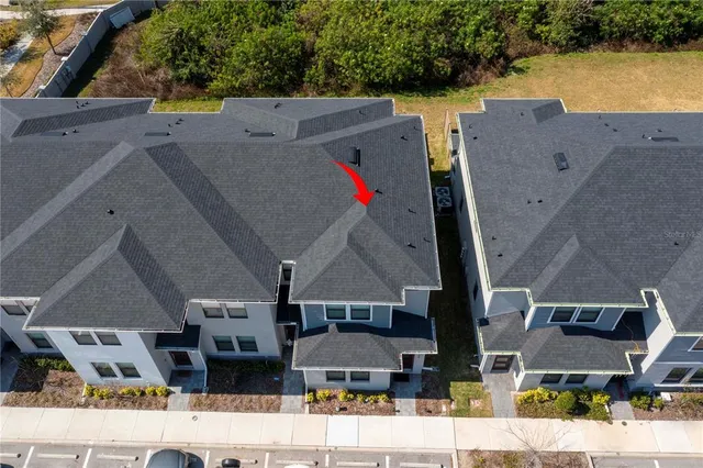an aerial view of multiple houses with outdoor space