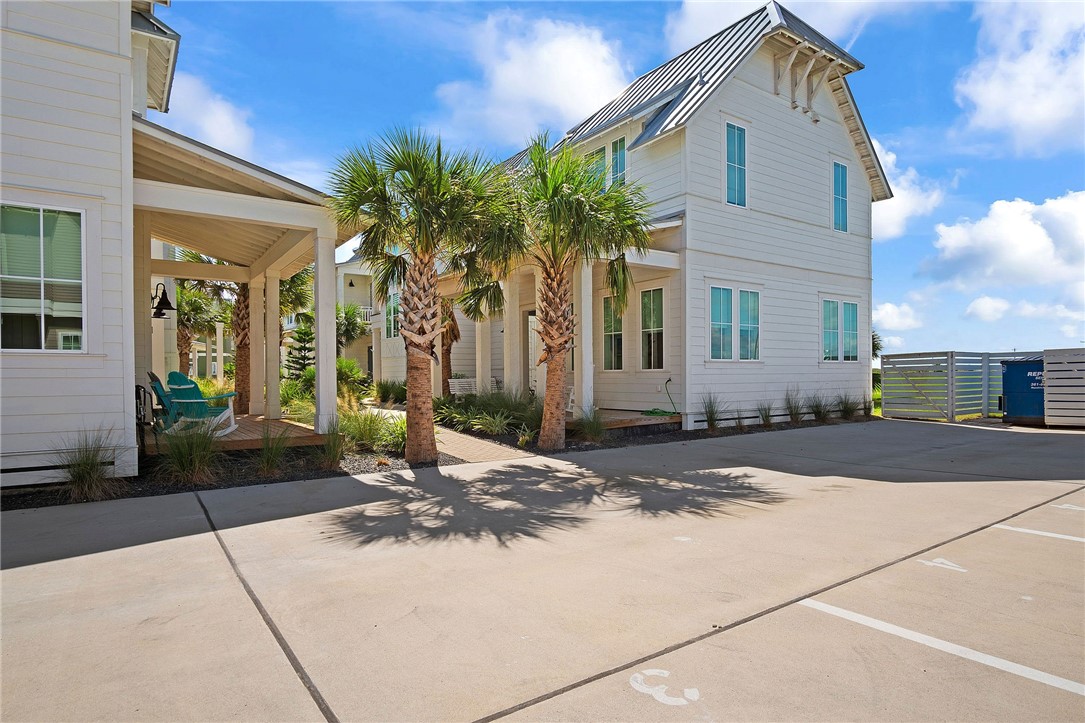 214 Sunset Avenue, Unit 2 Port Aransas, TX 78373 - Photo 29 of 37 a view of a house with a yard and potted plants