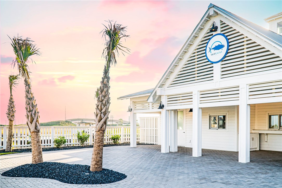 214 Sunset Avenue, Unit 2 Port Aransas, TX 78373 - Photo 30 of 37 a front view of a house with a garden