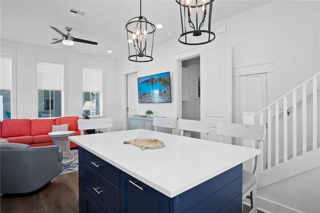 a kitchen with stainless steel appliances a sink a stove and a window