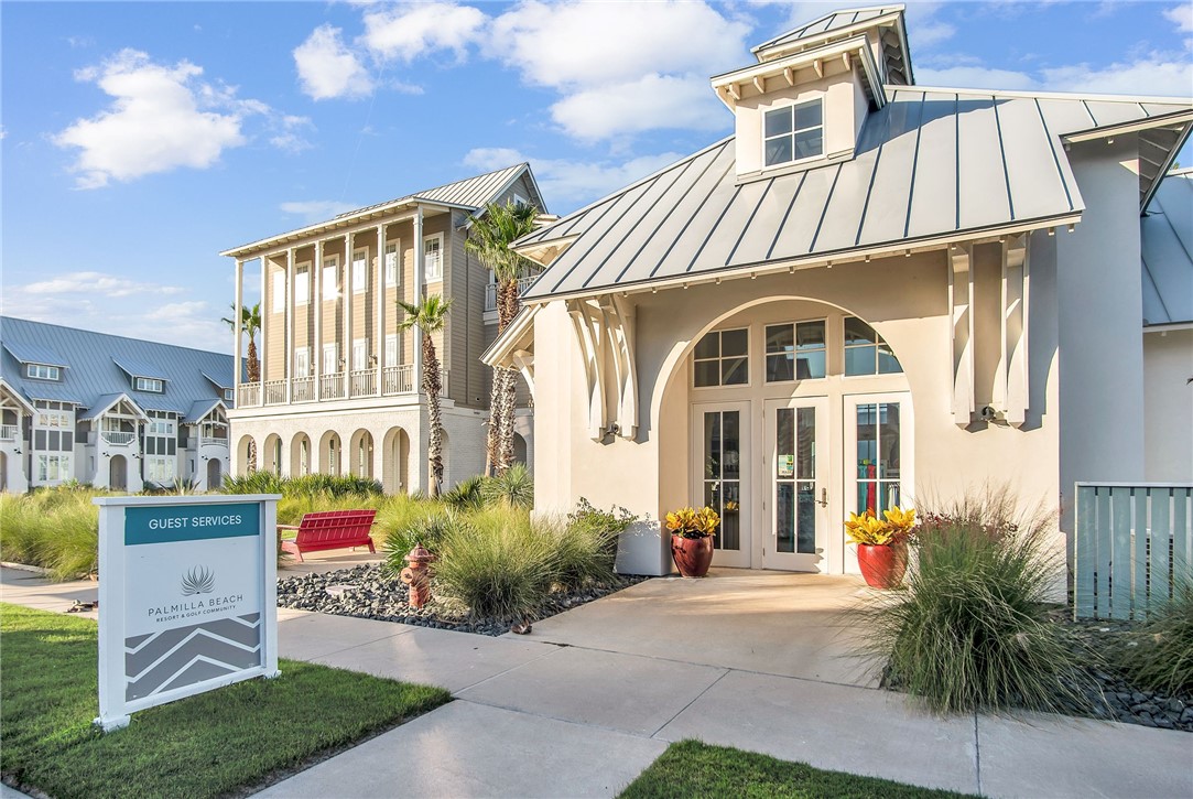 214 Sunset Avenue, Unit 2 Port Aransas, TX 78373 - Photo 34 of 37 a front view of a house with a garden